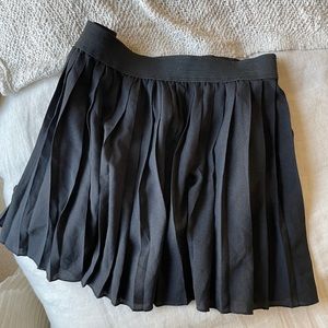 Pleated black mini skirt
